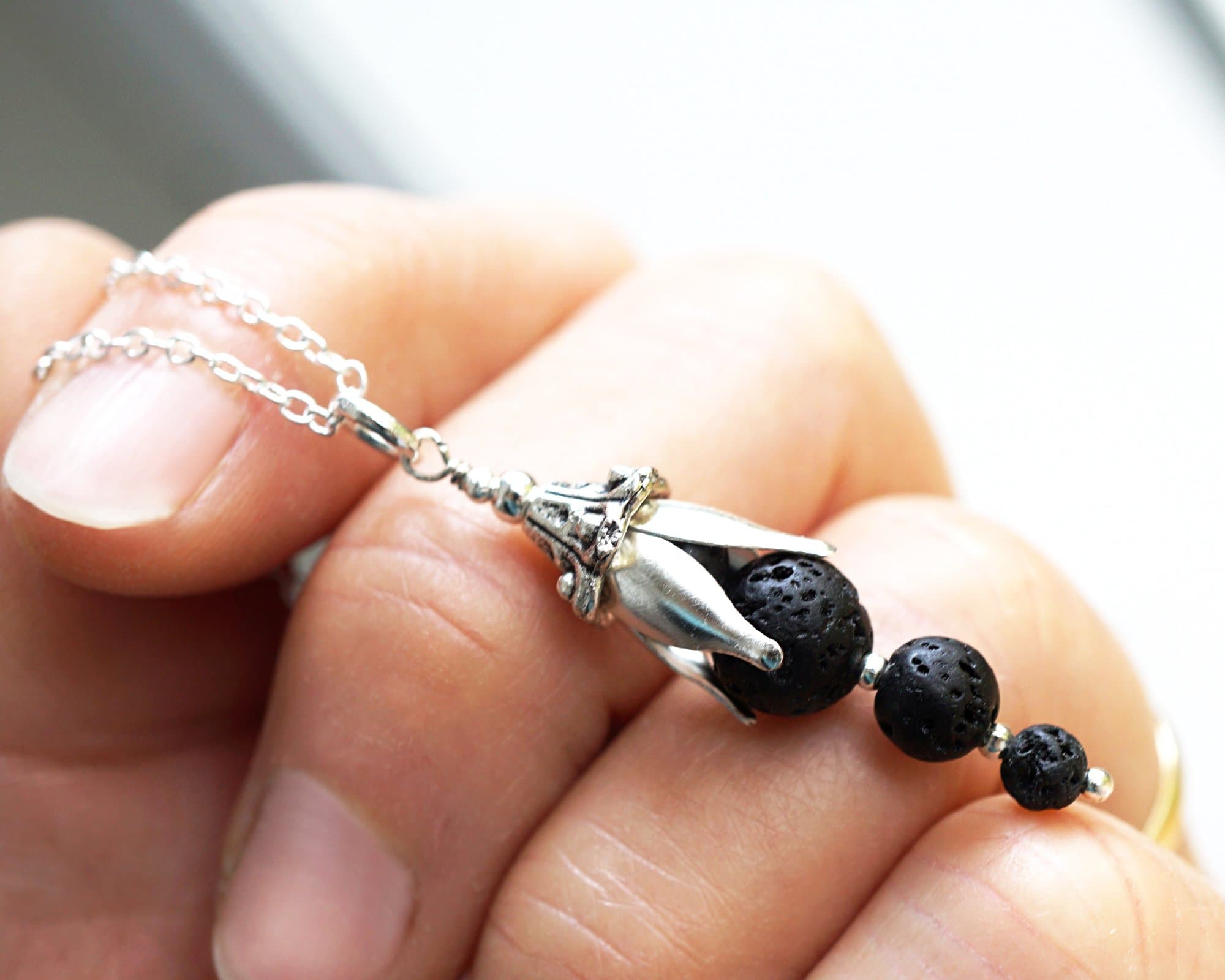 Essential Oil Diffuser Necklace Raw Black Lava Stone Bell Flower Full Moon Pendant Boho Aromatherapy Jewelry Sterling Silver Chain Natural Rock Balls Gift for her Handmade and Crafted by KapKaDesign